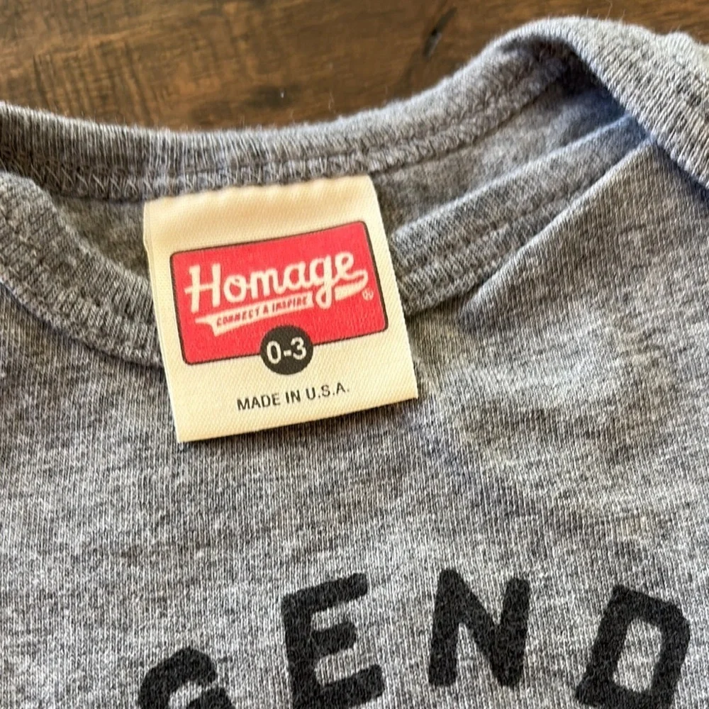Gray Homage Legends Never Cry Baby Onesie